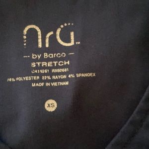 NrG By Barco navy scrub top seaming detail